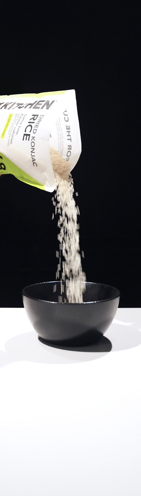 CUT KITCHEN rice pouring from the bag into a ceramic bowl