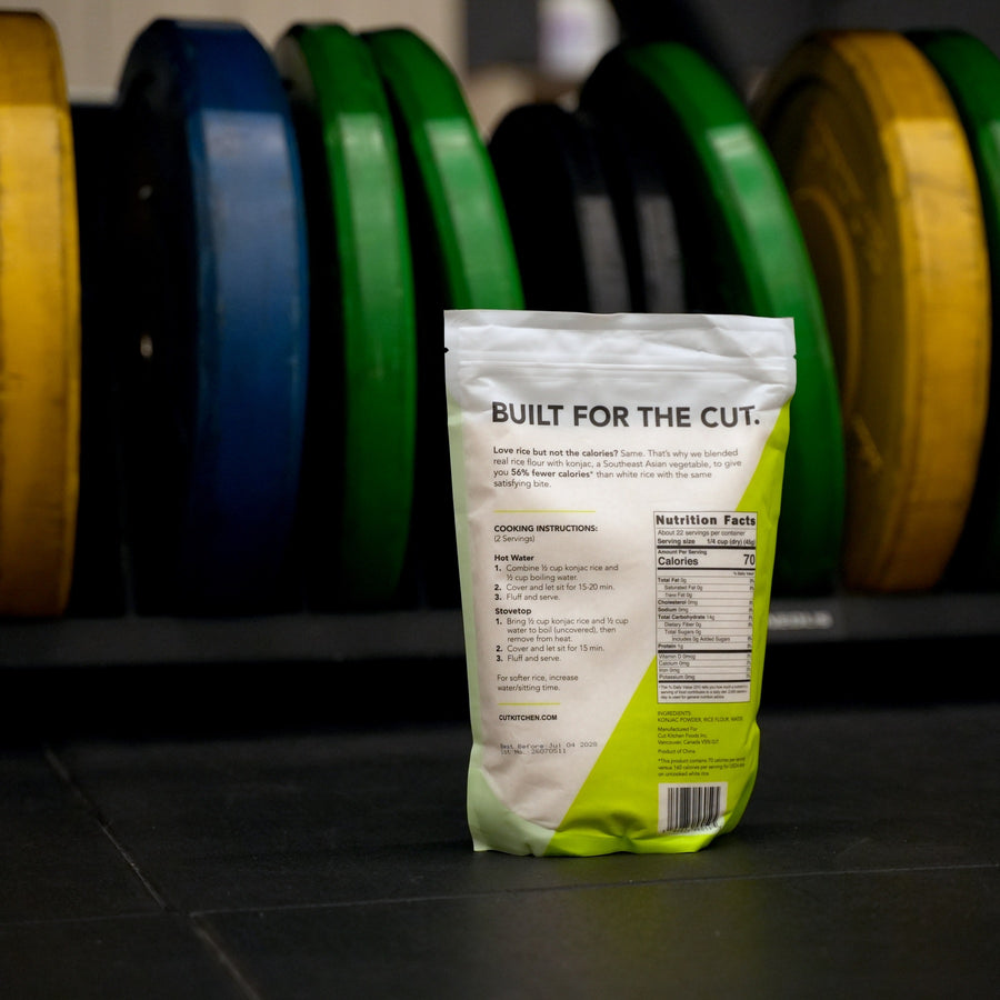 Cut Kitchen Dried Konjac Rice bag in front of coloured gym weight plates